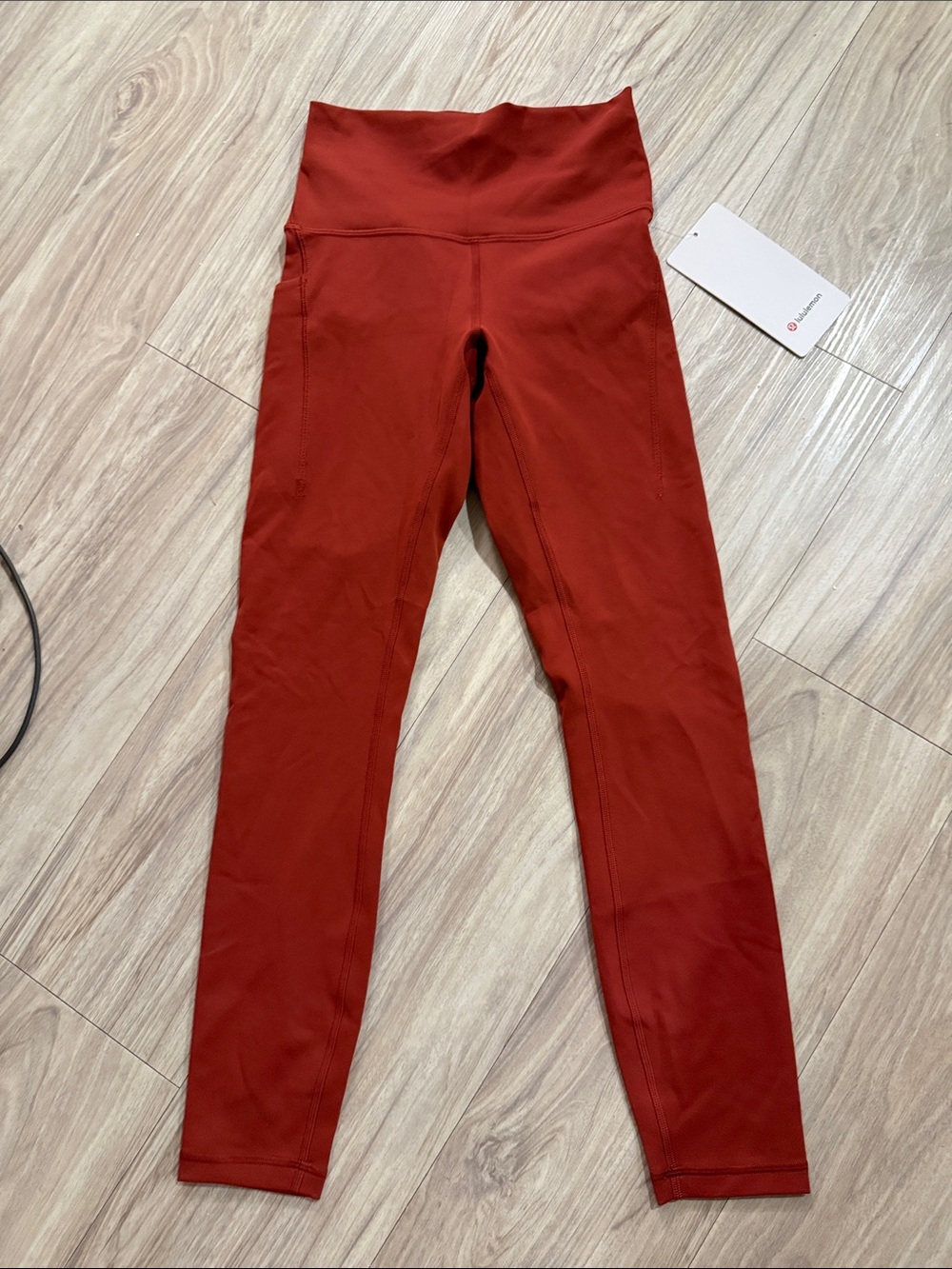 Lululemon Wunder Train HR tight 25” pockets (size 4, never worn). Deep orange